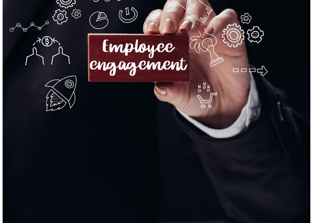 Man holding employee engagement plaque