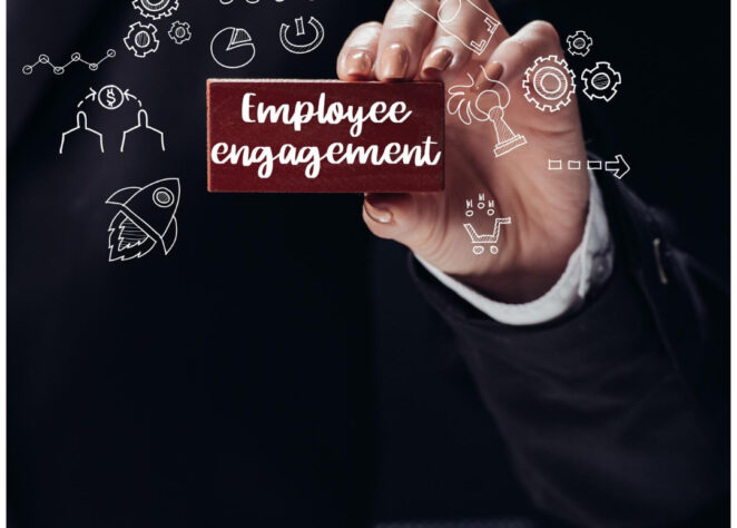 Man holding employee engagement plaque